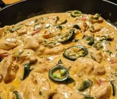 Creamy jalapeño chicken skillet dish served in a pan